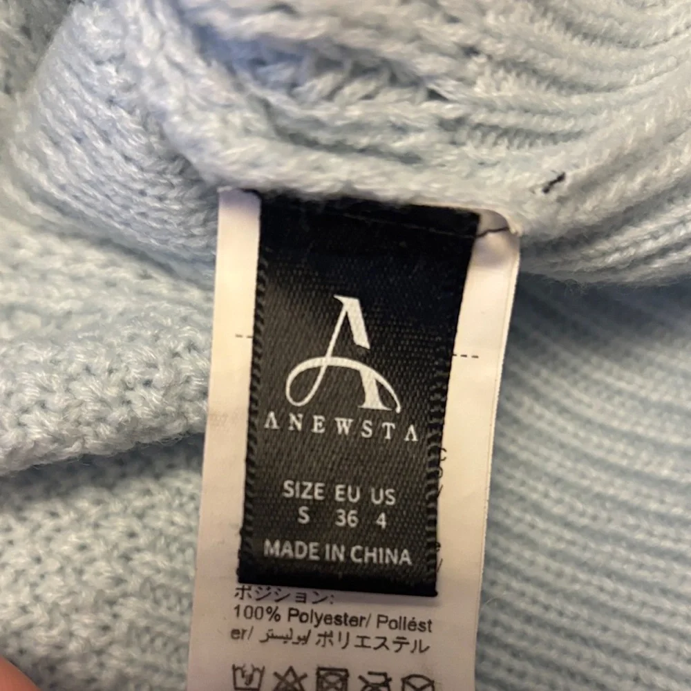 Elegant Light Blue Knit Sweater with Embellishments
